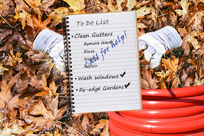 Gutter Cleaning in Marlboro, To do list written in notebook on leaf covered ground with work gloves and a hose