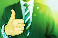 Person  in a  suit giving a thumbs up