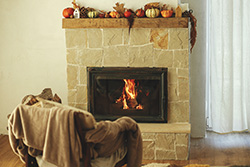 Autumnal designed hearth and fireplace maintained by chimney service in Forked River